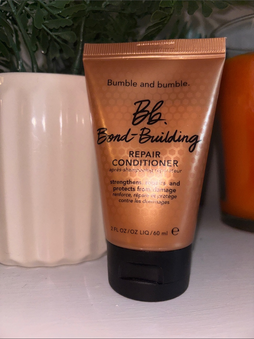 Bumble and bumble bond building repair conditioner 2oz travel size.